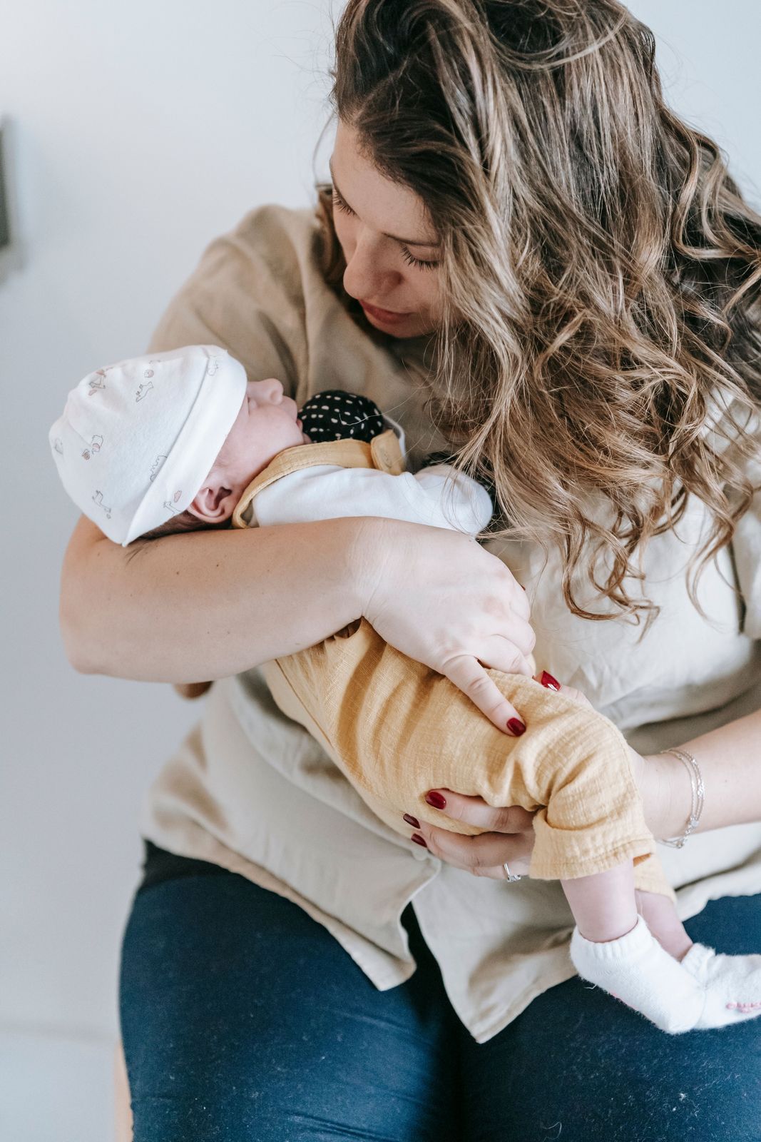A parent holding their newborn